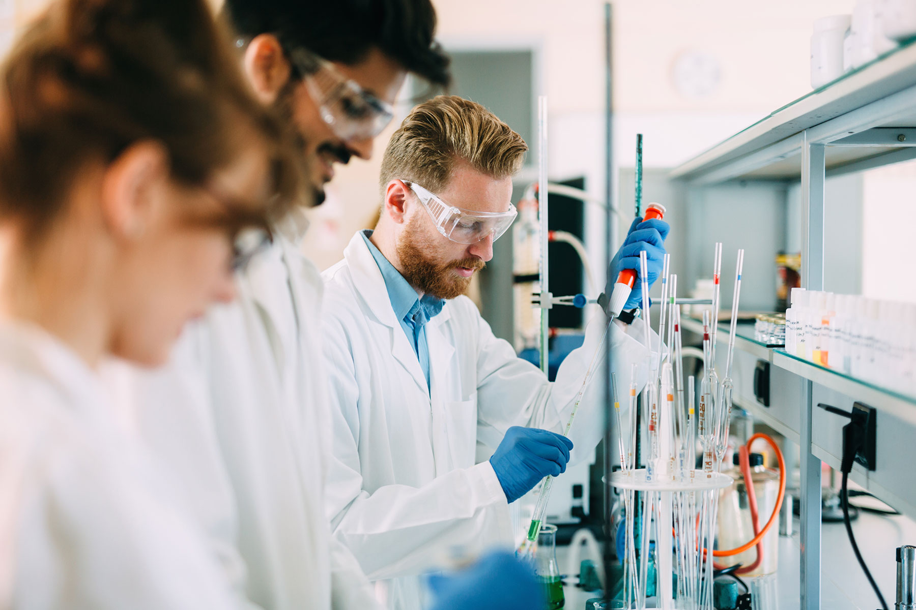 Biomedical engineers working with laboratory equipment